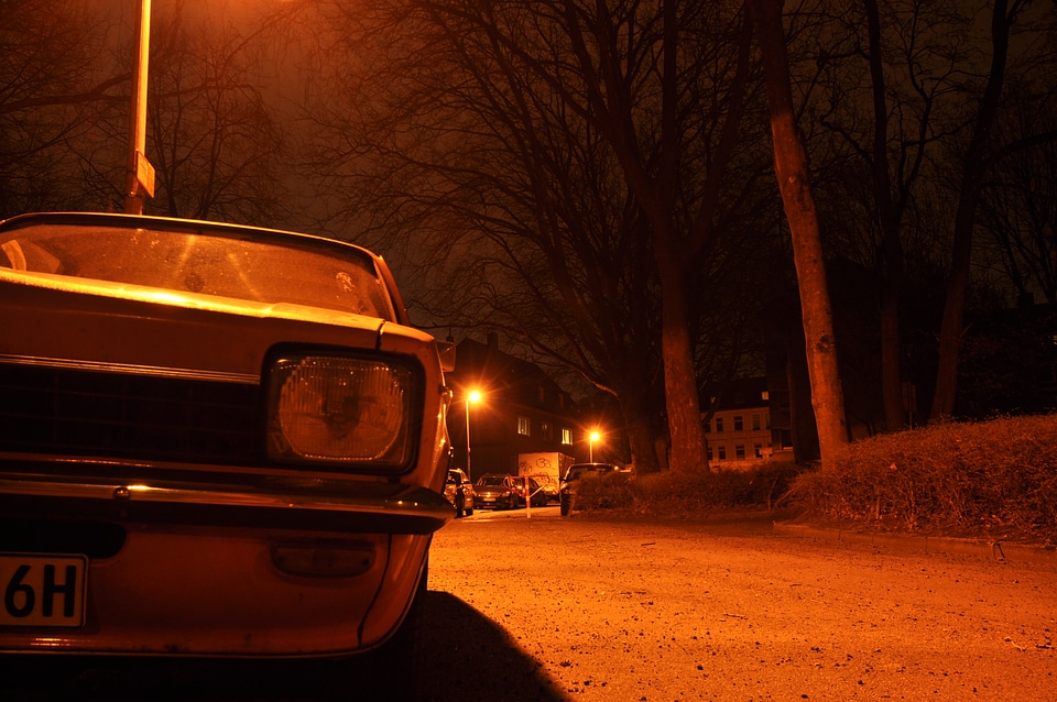 Orange Opel Kadett at night