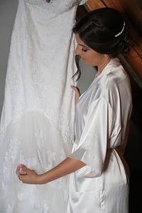 Bride looking wedding dress photo