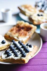 Banana and bluberries waffles with espresso photo
