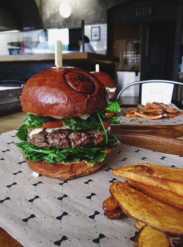 Tiny pickles on top of burger