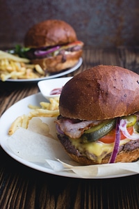 Burger with cheddar cheese, bacon and fries