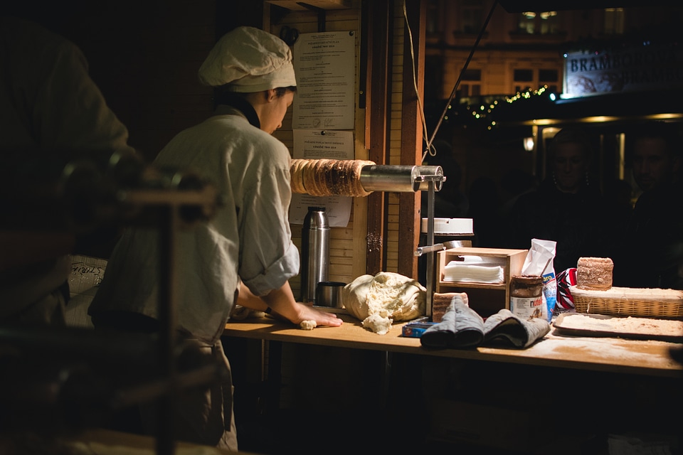 Preparing Czech traditional Trdelnik sweet pastry
