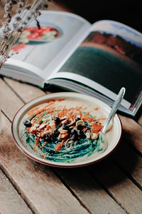 Spirulina oats cream with blueberries and nuts photo