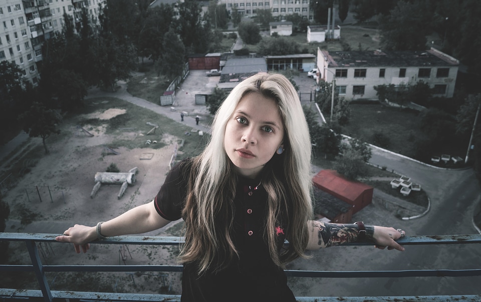 Girl with Tattoo on the Balcony photo