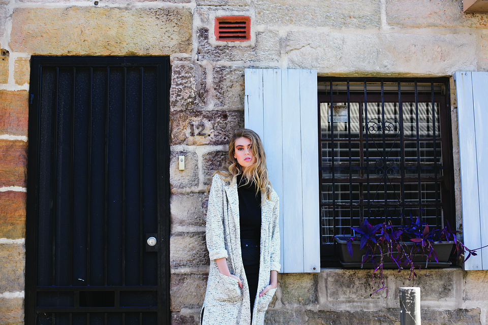 Woman Standing in Front of Old Building