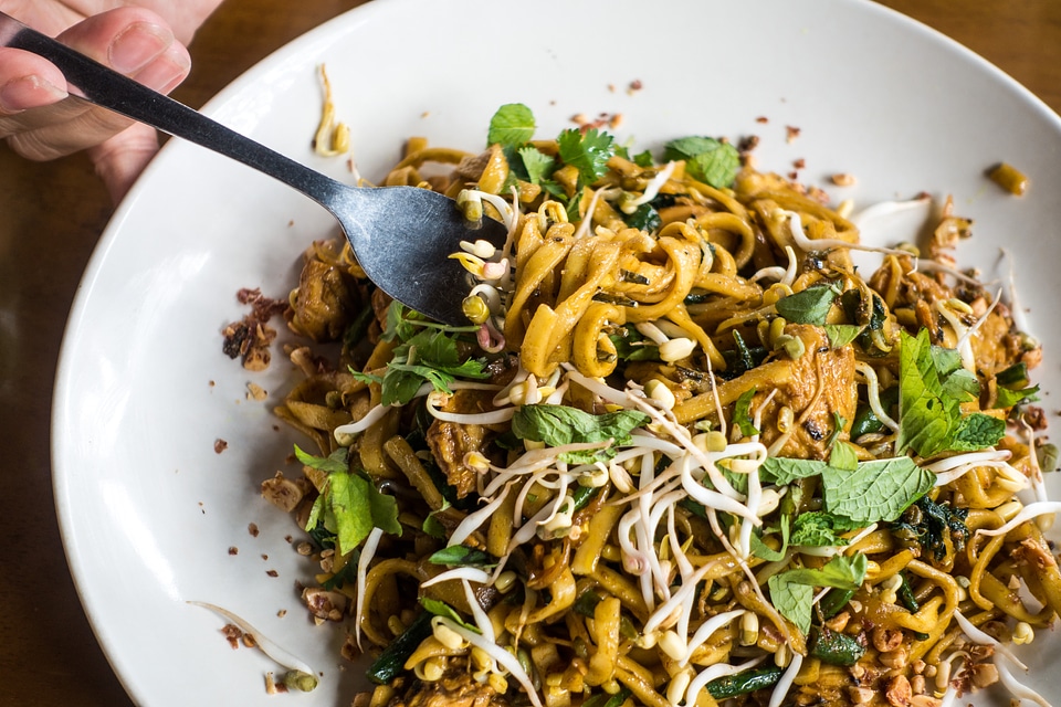 Eating tasty egg noodles