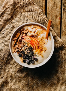 Banana oatmeal with blueberries, chocolate and apple photo