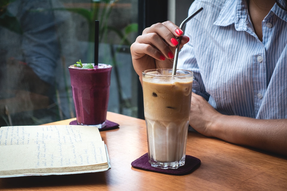 Girl drinking ice coffee latté