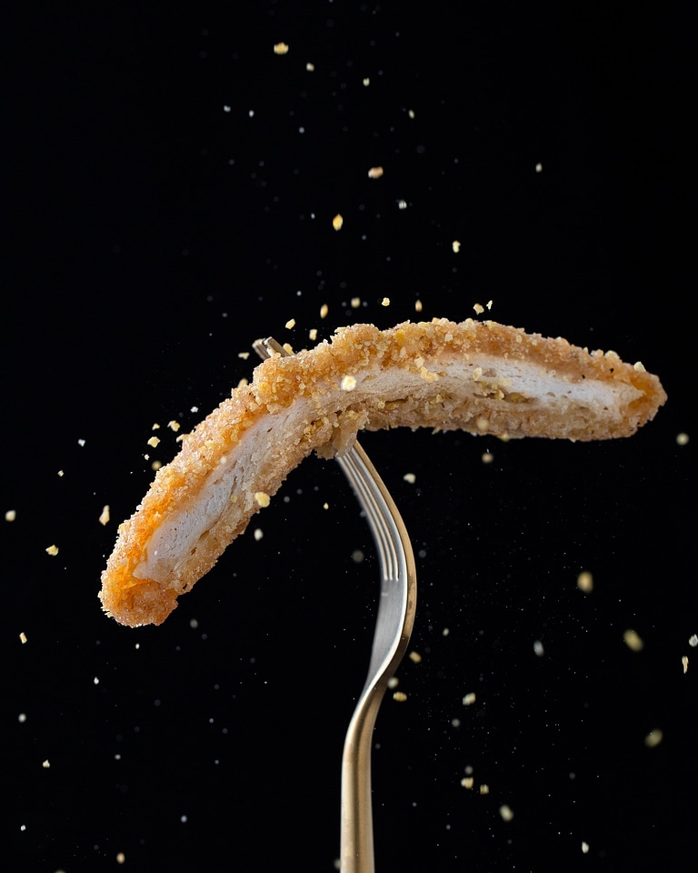 Crispy chicken on a fork detail