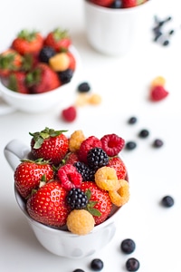 Colorful healthy fresh berries in a cup photo