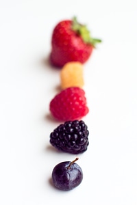Fresh raspberries with other red fruit and vegetables photo
