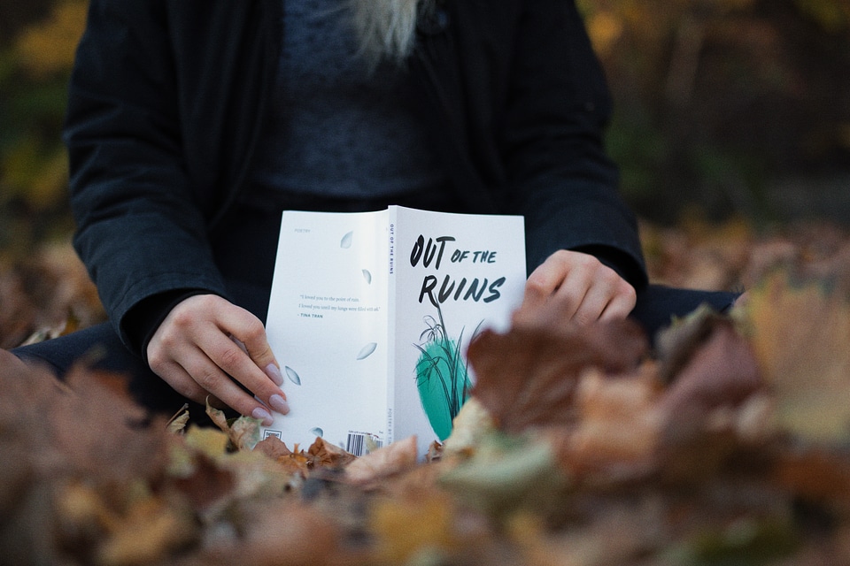 Closeup of Female Hands with Book Outdoors