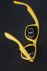Yellow plastic sunglasses photo