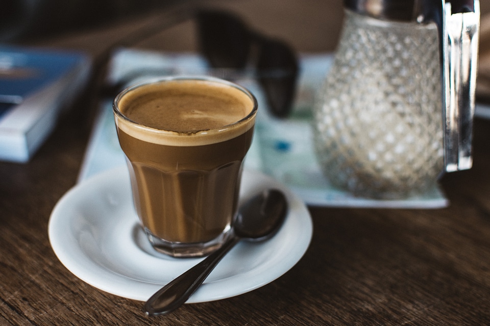 Coffee cortado in a glass cup photo