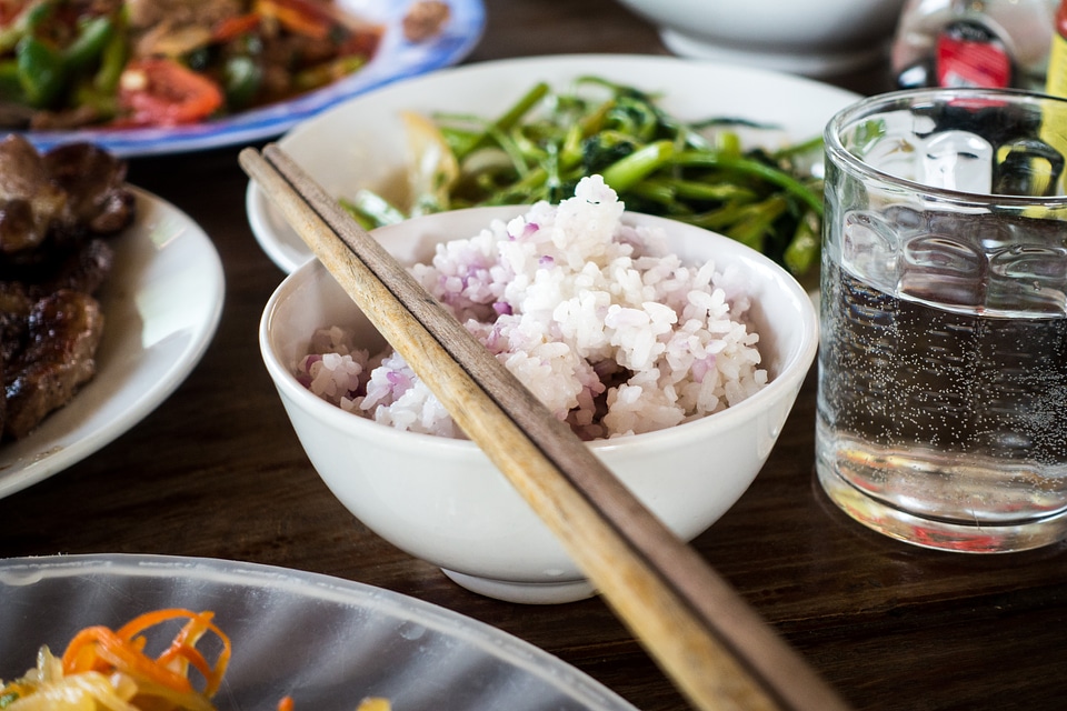 Rice in a bowl with chopsticks