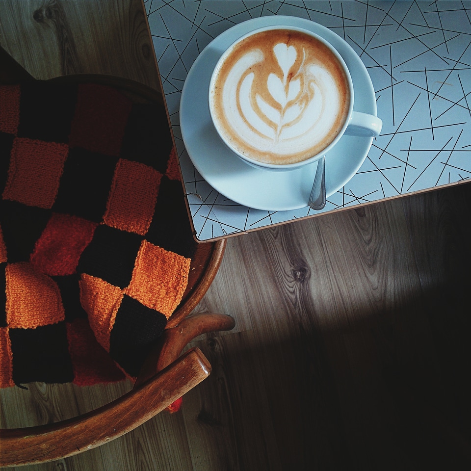 Having cappuccino in a coffee shop photo