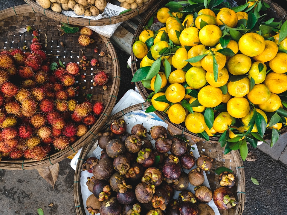 Baskets of rambutan, mangosteen and tangerines