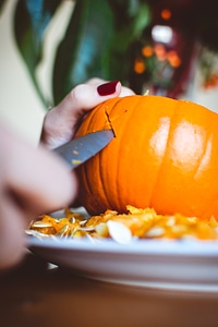 Carving Halloween pumpkin