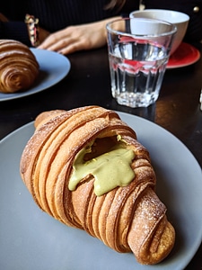 Pistachio croissant in a coffeeshop