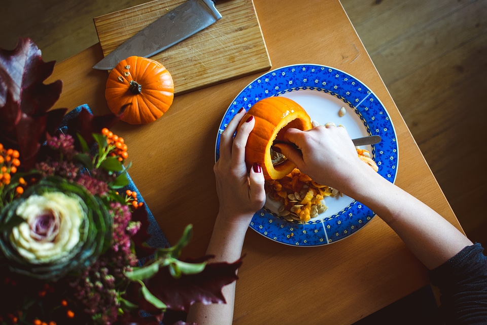Carving Halloween pumpkin