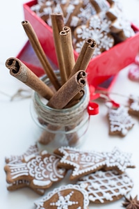 Dried cinnamon with a bunch of Christmas gingerbreads