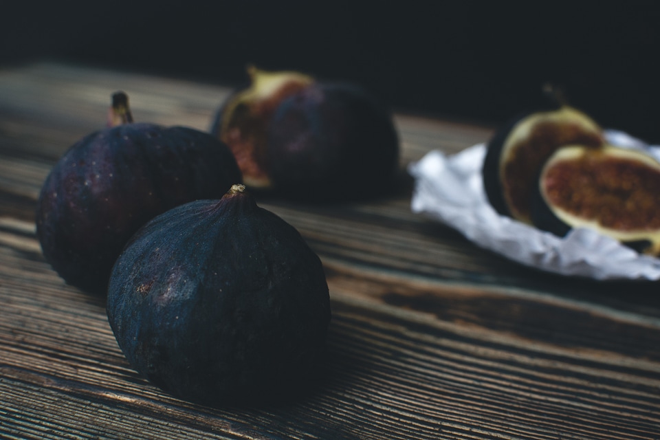 Fresh ripe figs on a wooden background