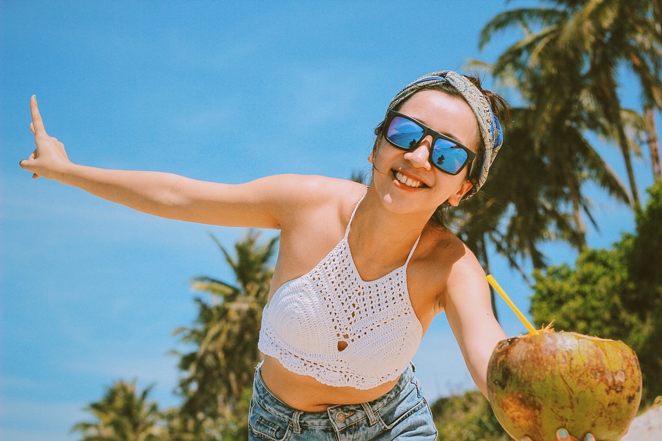 Happy Young Girl Drinking Fresh Coconut Water
