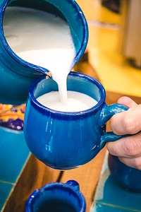Pouring traditional Iranian yogurt drink Doogh