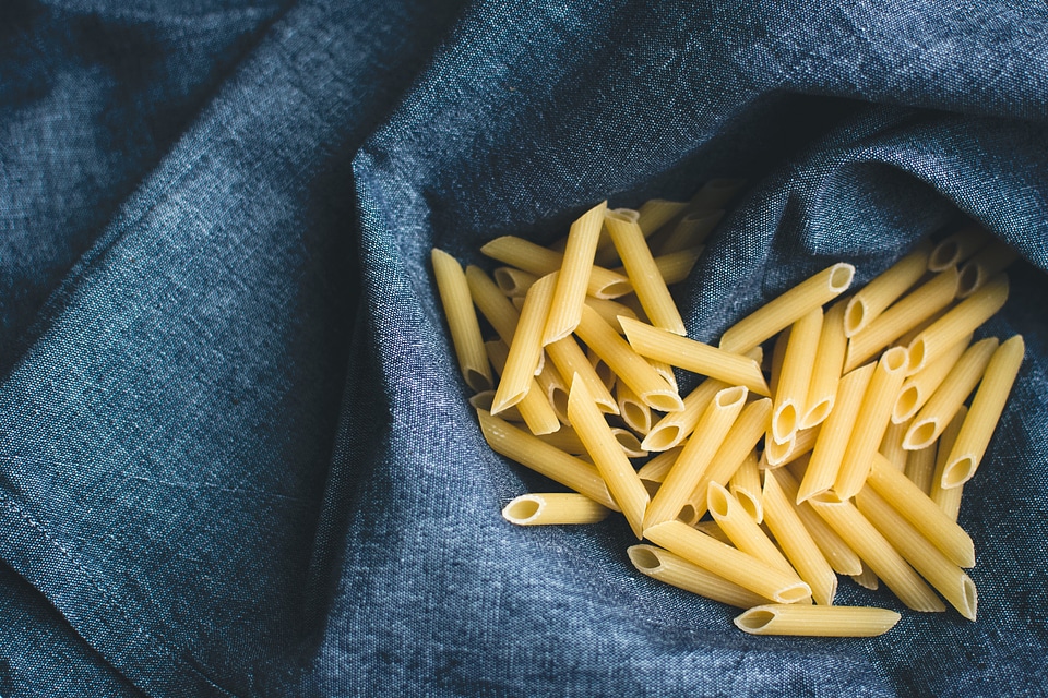 Pasta penne in a blue linen