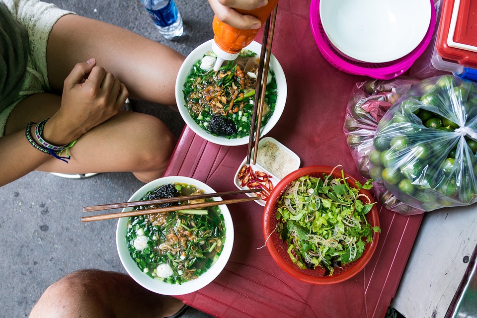 Eating Vietnamese soup with chicken balls