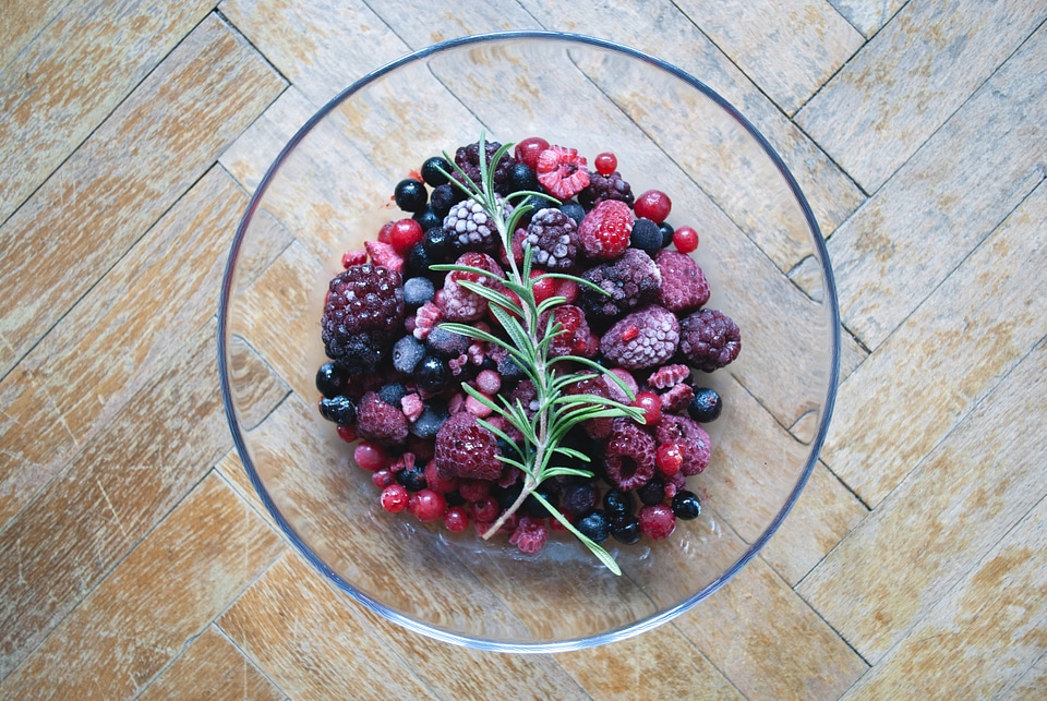 Frozen berries on a wooden floor