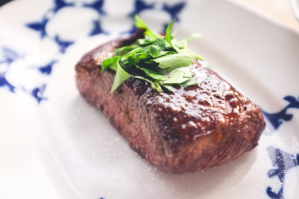 Beef steak with herb and salt close up