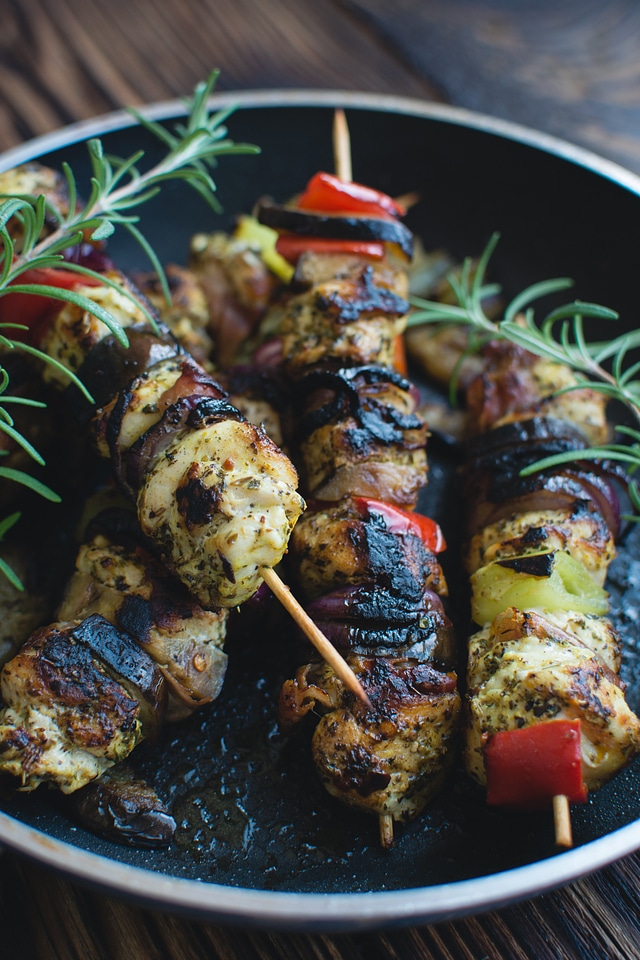 Chicken skewers on a wooden background