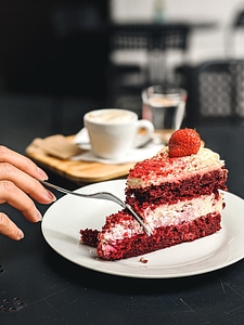 Girl eating strawberry Pavlova cake photo