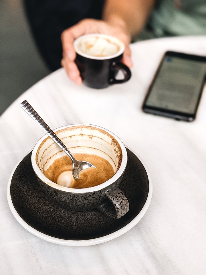 Finished cup of coffee with milk photo