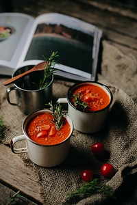 Tomato soup in a tin mug photo