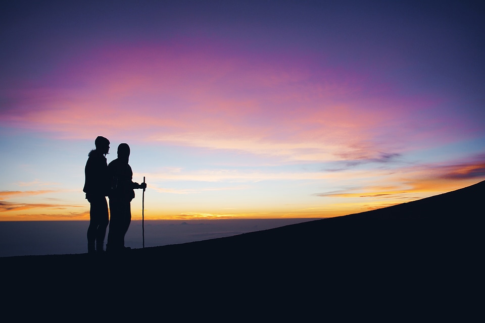 Couple Enjoying Sunset in the Mountains photo