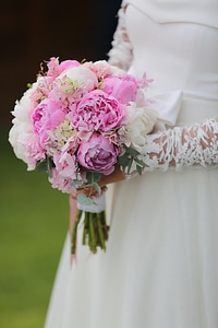 Bride holding wedding bouquet photo