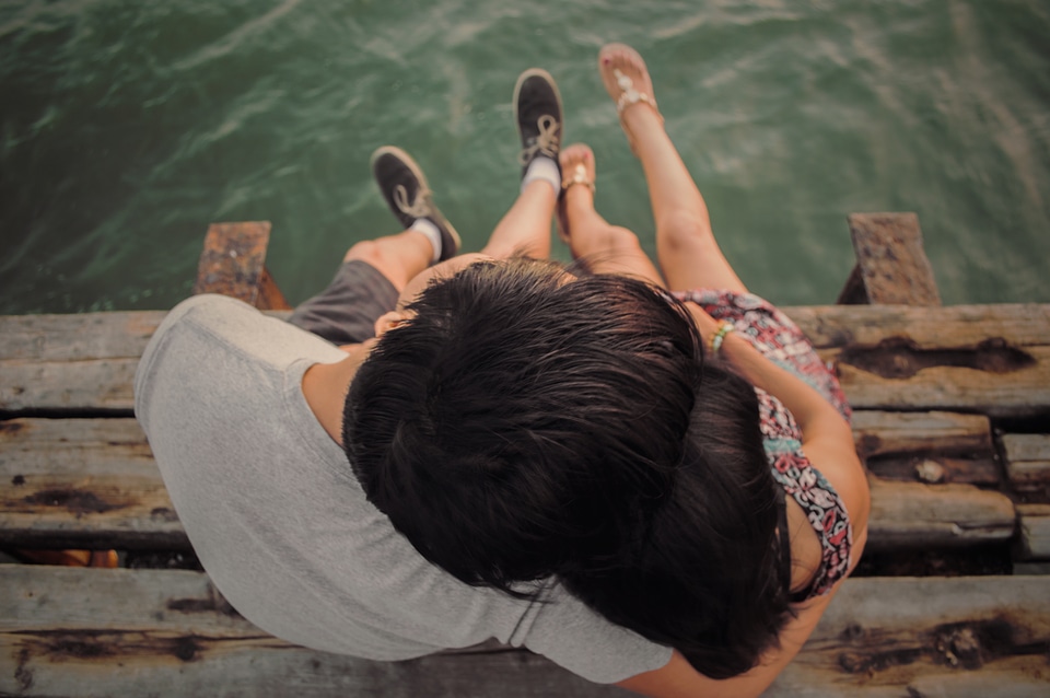 Couple Hugging on the Pier photo