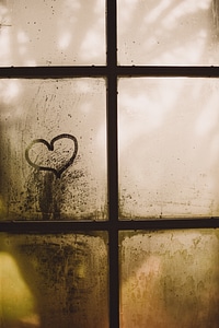 A Heart Painted on a Misted Window photo