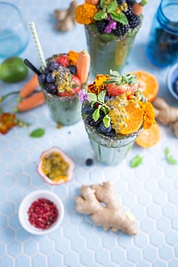 Vegan Smoothie Garnish with Fruits and Flowers photo