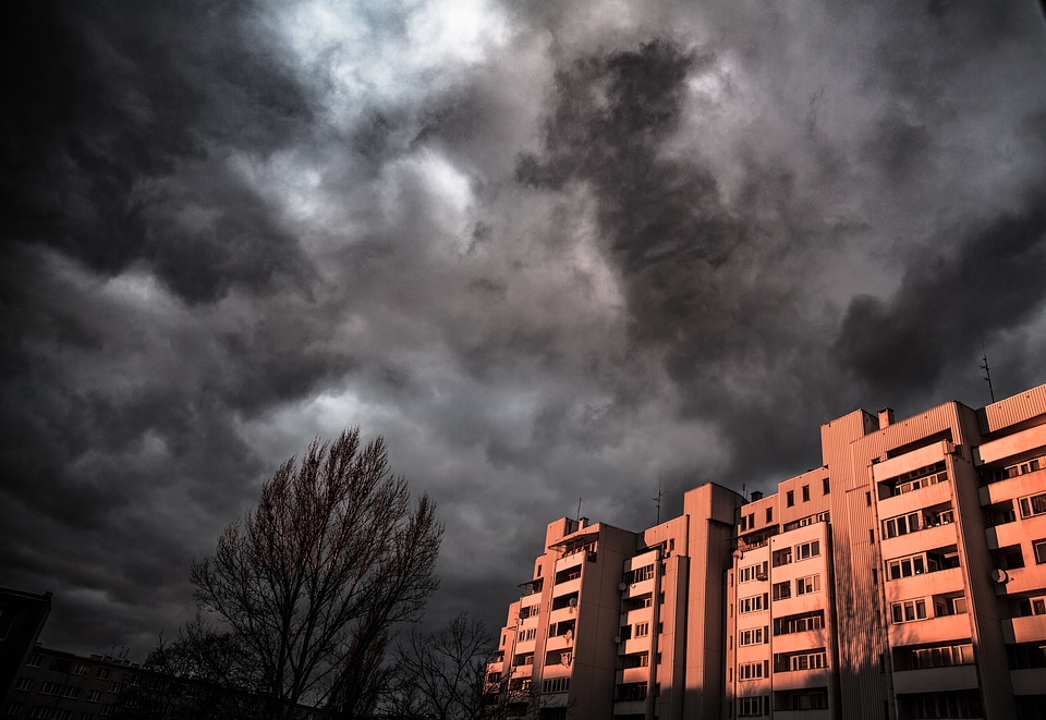 Block of Flat against Grey Dramatic Sky
