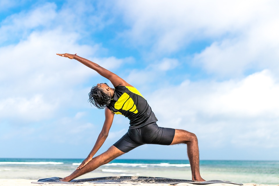 Man Practice Yoga on the Beach photo