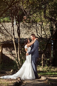 Standing newlyweds bride
