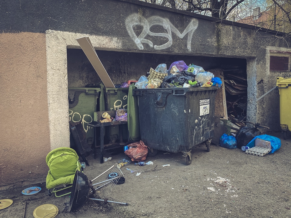 Messy Trash Containers in the Backyard