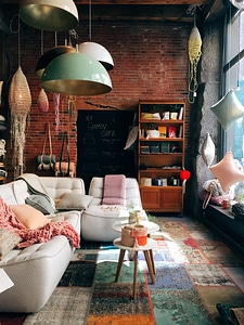 A Cozy Room with a Brick Wall and a Gray Sofa photo