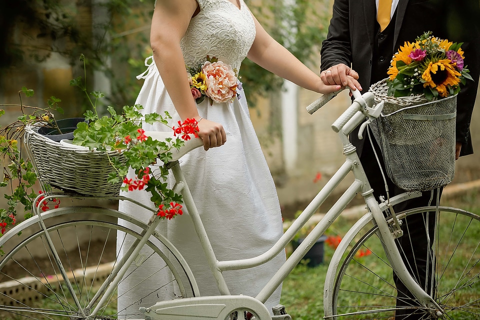 Groom bicycle bride