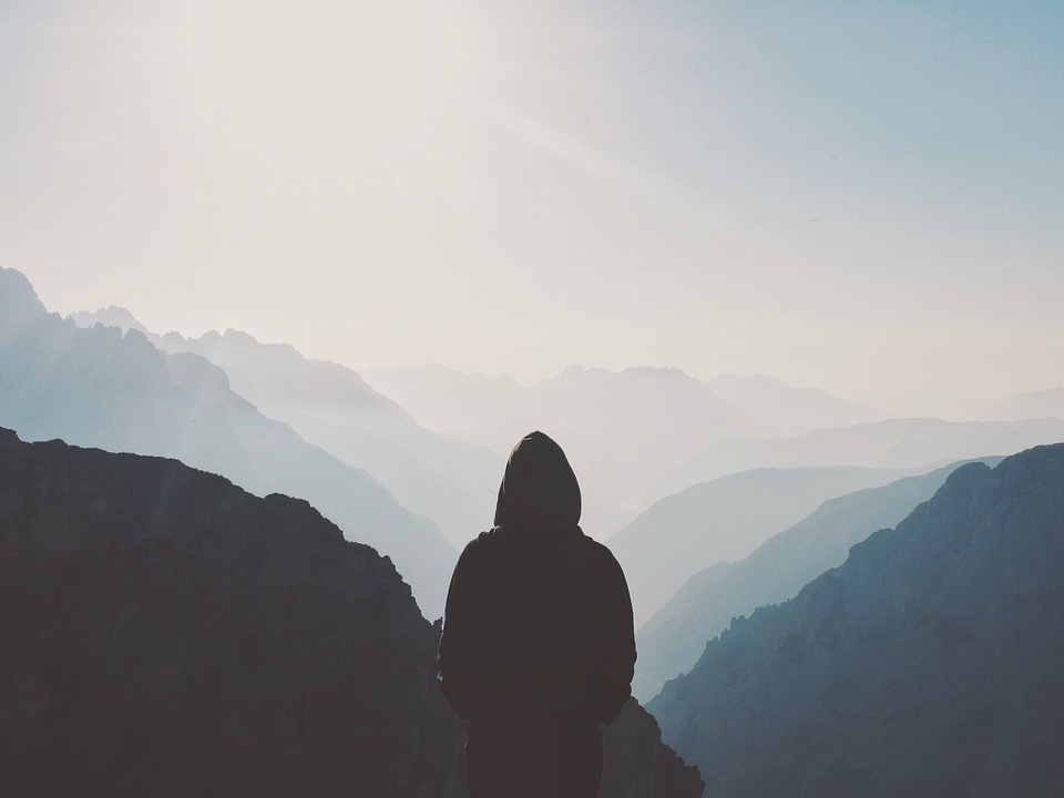 Man Standing and Looking on the Vally photo