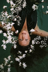 Brunette Floating with White Flowers photo