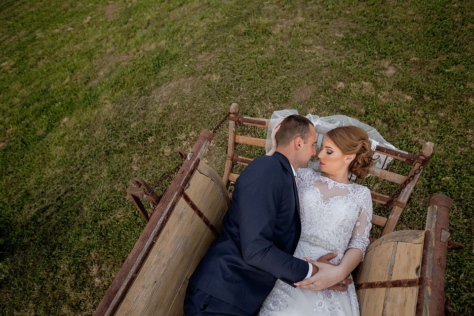 Bride laying groom photo